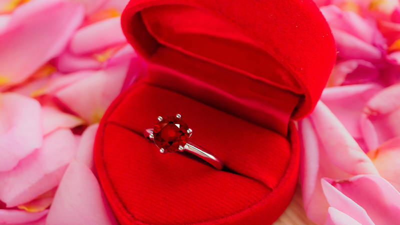 a ruby ring in a ring box