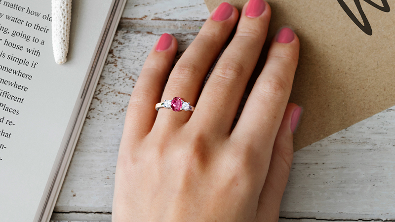 A woman wearing pink tourmaline ring